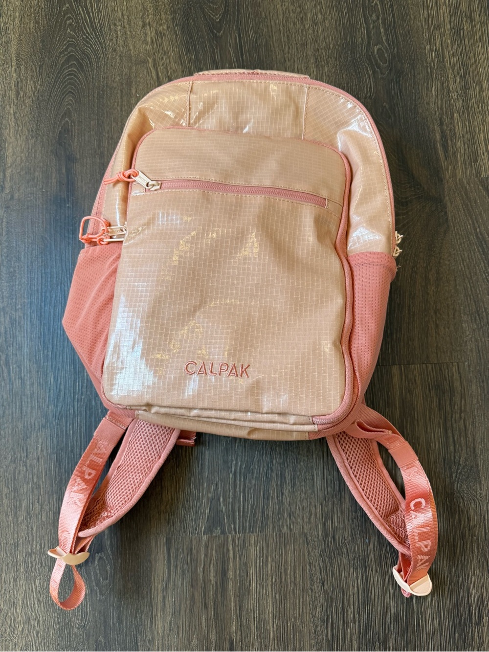 Calpak Terra Laptop Backpack in Canyon with water reservoir and flexible straw.